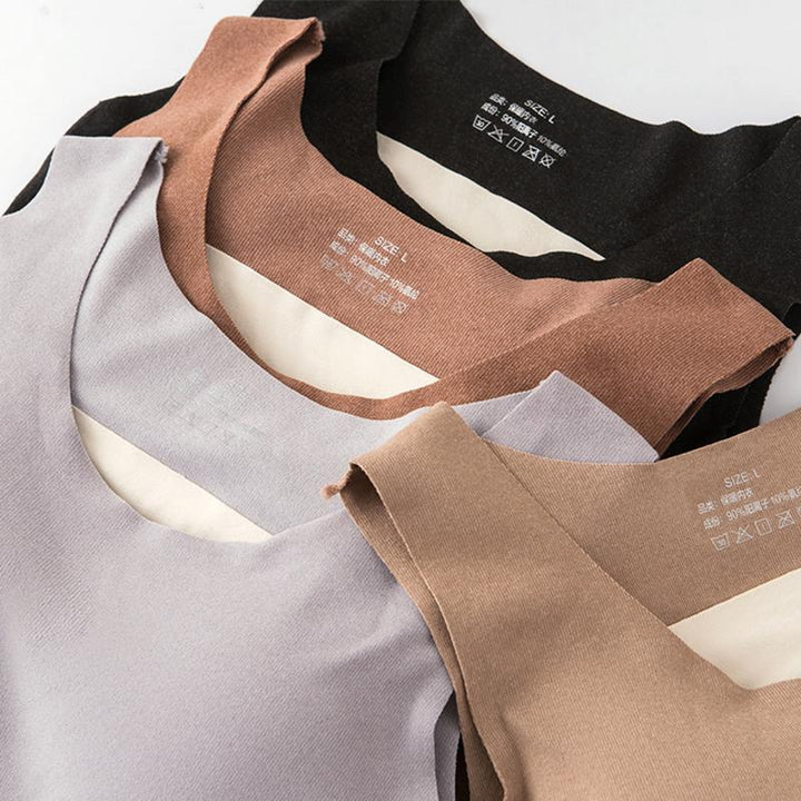 Elegant dam termisk fleeceväst i grå färg, stilren design med högvärmande och andningsbart material, perfekt för kalla dagar.