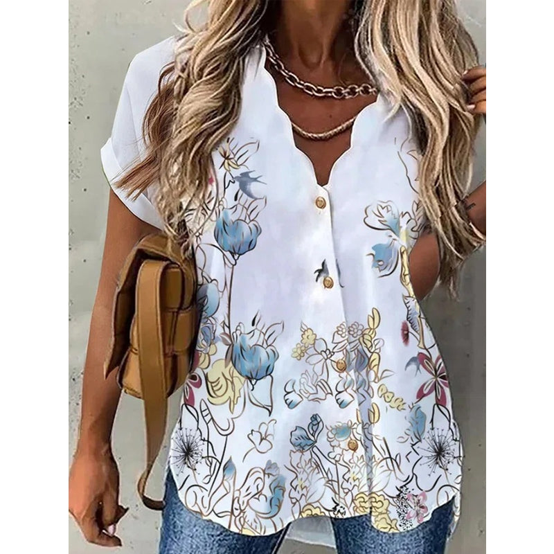 "Elegant dam V-ringad kortärmad blus med blommigt mönster för en feminin och stilfull look."
