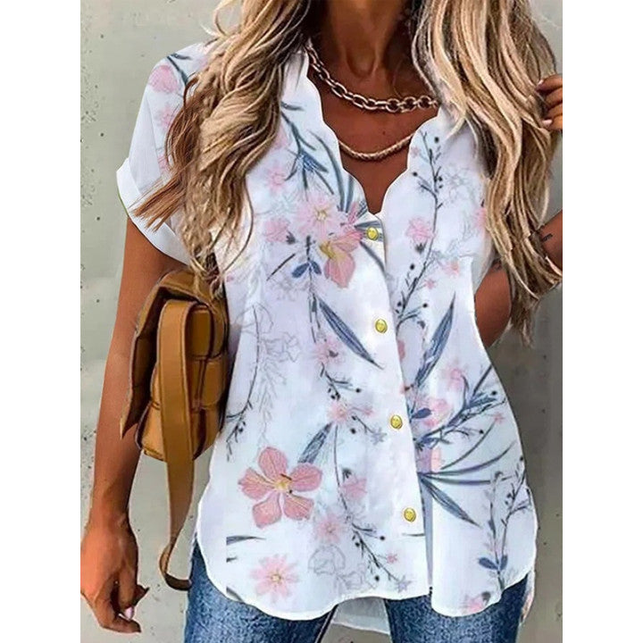 "Elegant dam V-ringad kortärmad blus med blommigt mönster för en feminin och stilfull look."