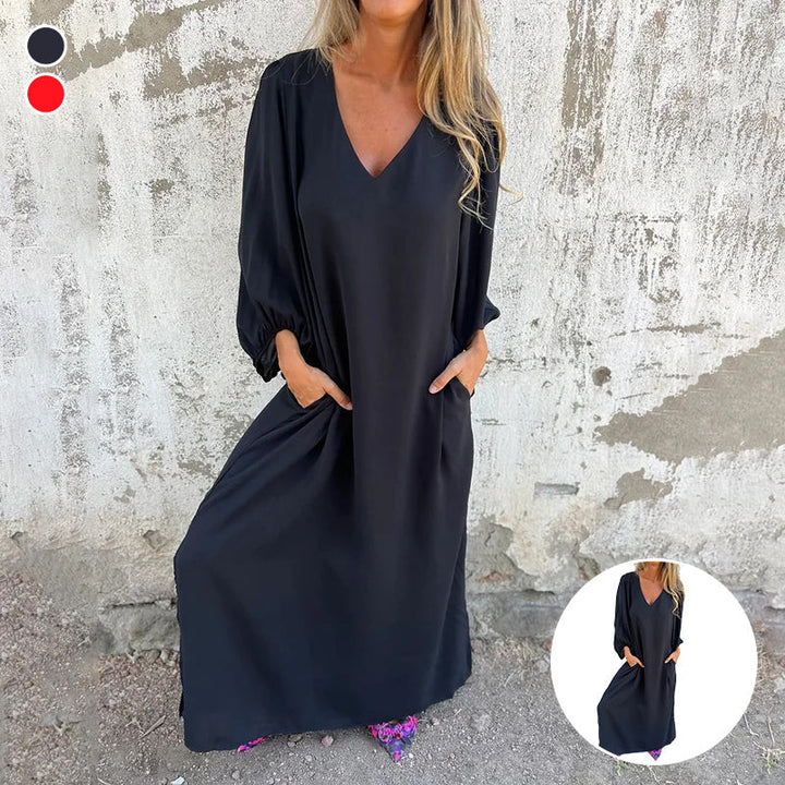 "Elegant dam V-ringad sommarklänning med lyktärmar, lös passform och praktiska fickor i lätt, ventilerande material."