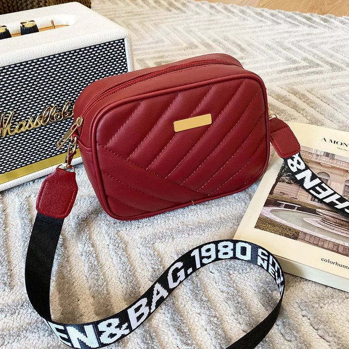 Dam Elegant Zip 'n Go axelväska. Elegant handväska med dragkedja, en chic och praktisk accessoar.