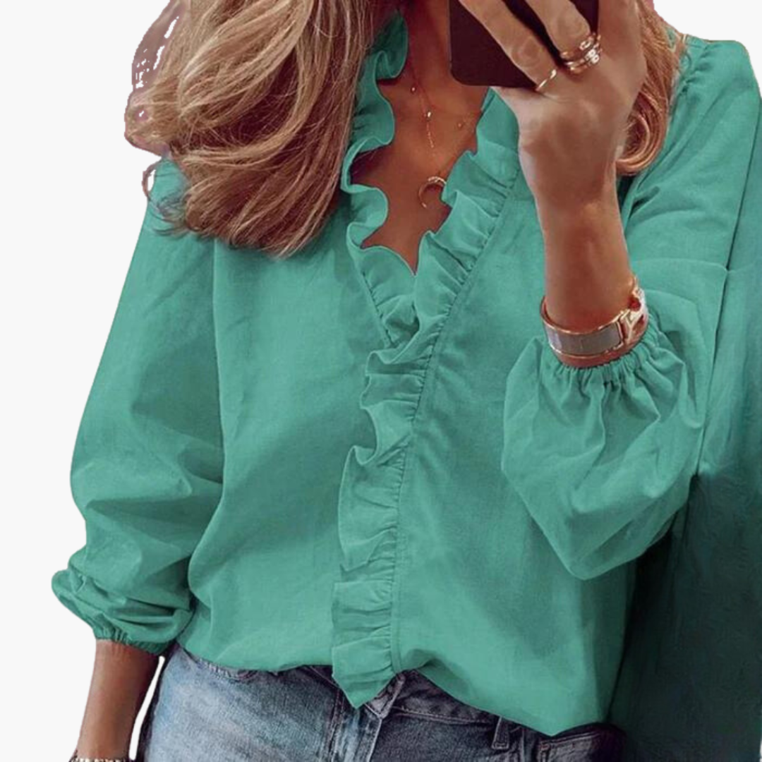 Chic damblus med volang och V-ringning. Långärmad, elegant vardagsblus som passar som festtopp för kvinnor.