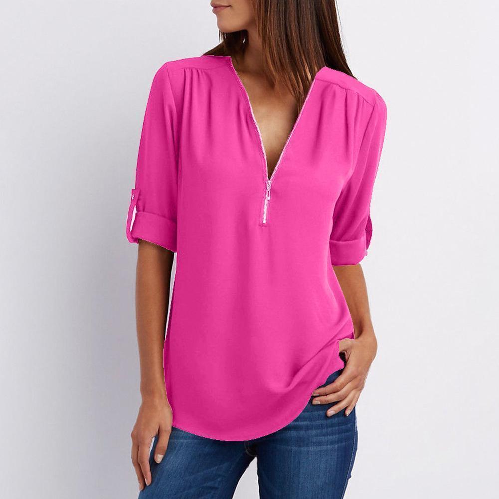 "Elegant damblusa med V-ringning och justerbar dragkedja, finns i flera färger; perfekt för stil och komfort."