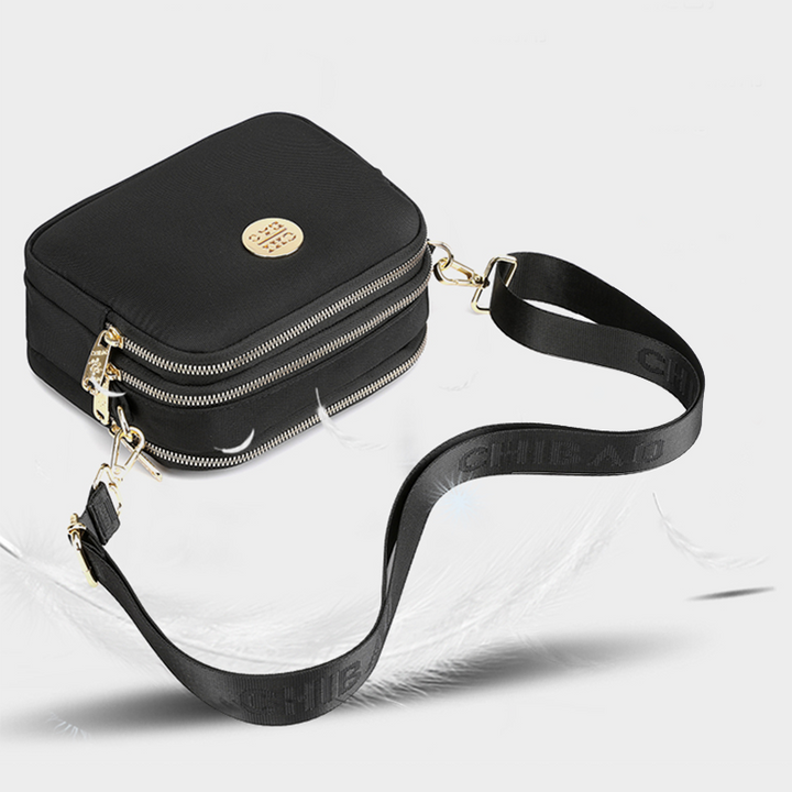 Elegant damers nylon crossbody kurirväska med multifickor, justerbar axelrem, tillgänglig i flera färger.