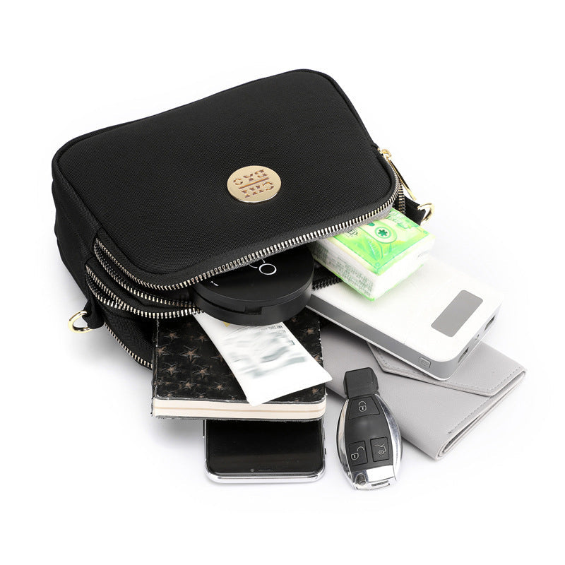 Elegant damers nylon crossbody kurirväska med multifickor, justerbar axelrem, tillgänglig i flera färger.