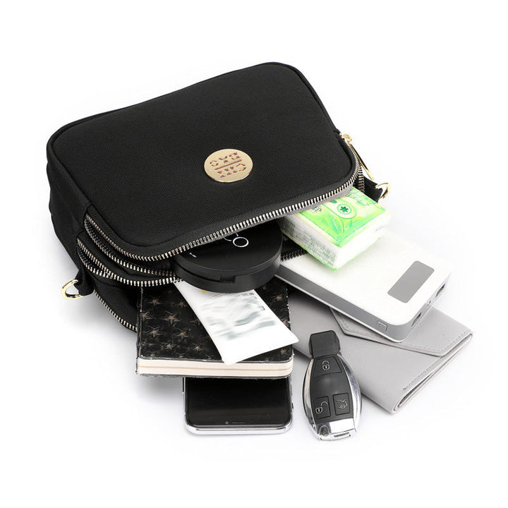 Elegant damers nylon crossbody kurirväska med multifickor, justerbar axelrem, tillgänglig i flera färger.