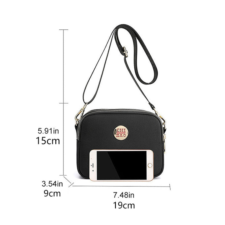Elegant damers nylon crossbody kurirväska med multifickor, justerbar axelrem, tillgänglig i flera färger.