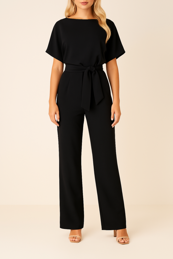 Mångsidig damjumpsuit med knytband & vida ben. Perfekt för både kontor och fest.