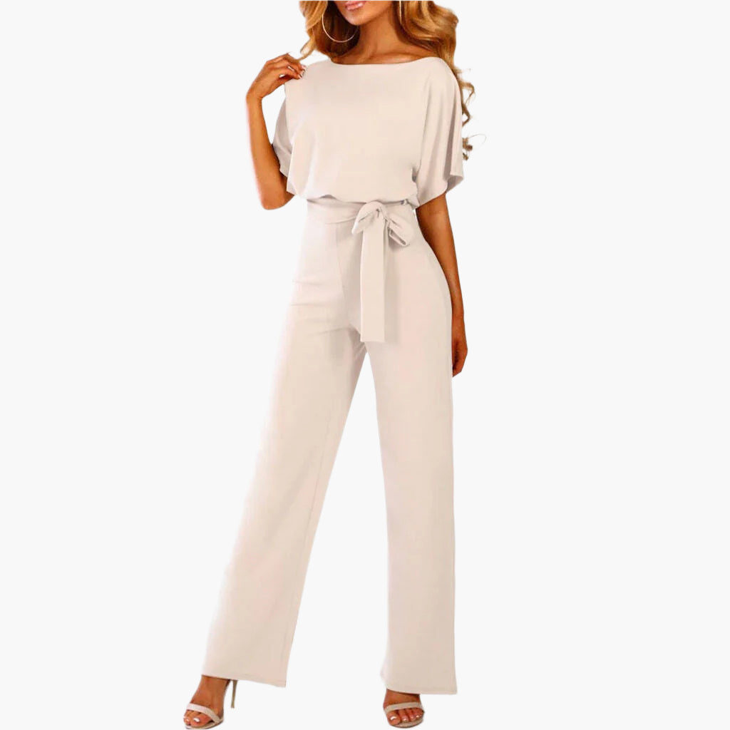 Elegant damjumpsuit med breda ben och ärmdetalj. Perfekt för fest, middag och kväll. Damoverall.
