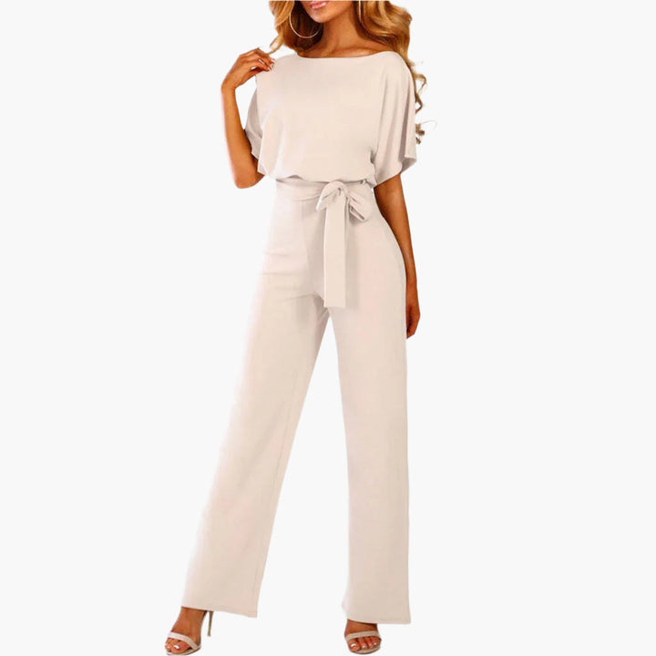 Elegant damjumpsuit med breda ben och ärmdetalj. Perfekt för fest, middag och kväll. Damoverall.