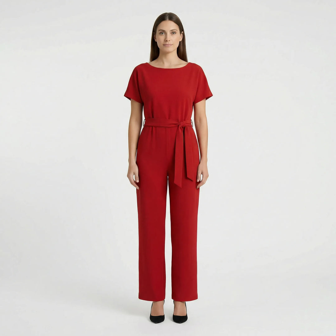Festlig damjumpsuit med vida ben och korta ärmar. Enkel att klä upp eller ner.
