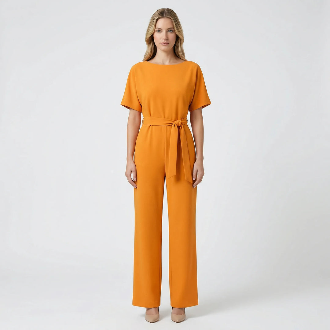 Tidlös damjumpsuit med vida ben. Elegant snitt och skön att bära för alla tillfällen.