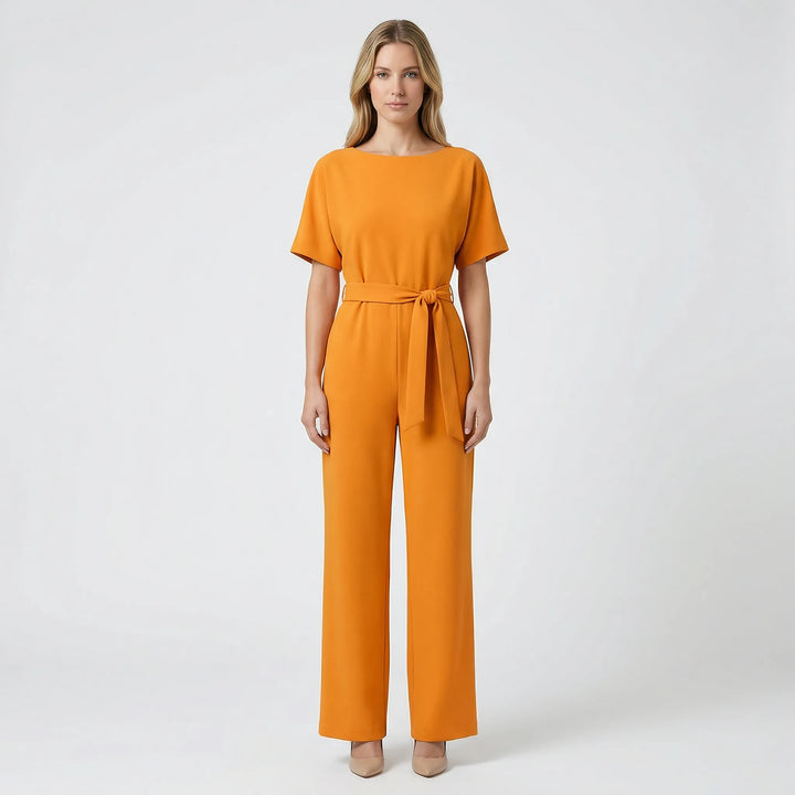 Tidlös damjumpsuit med vida ben. Elegant snitt och skön att bära för alla tillfällen.