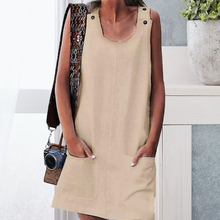 "Elegant damklänning med fickor och knappar i casual stil, rund halsringning, knälång, perfekt för vår och sommar."