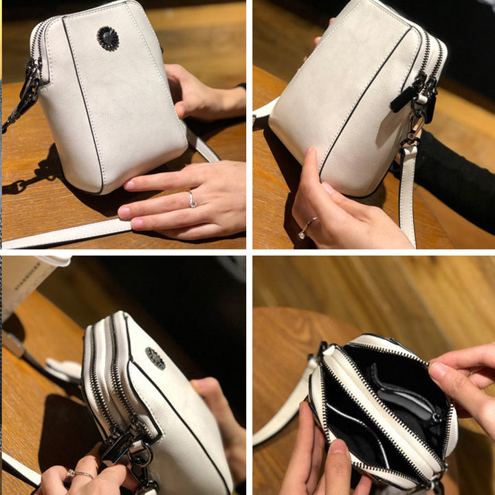 "Elegant damkurirväska i oljevaxat äkta läder, tidlös design, justerbar rem, perfekt för både vardags- och formella kläder."