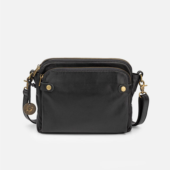 Elegant damläderväska crossbody med multifunktionell design, justerbara remmar och RFID-skydd i flera färger.