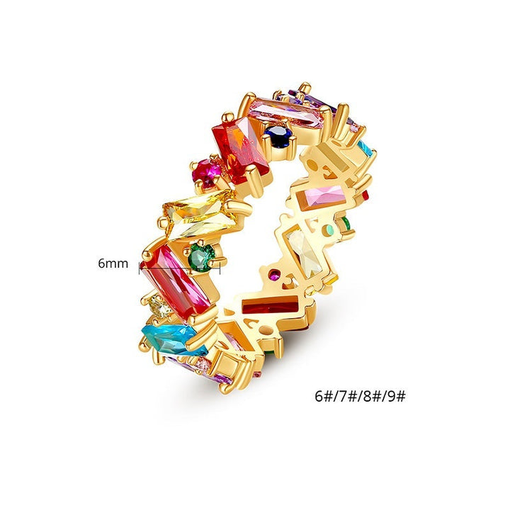 "Elegant damring i silver och guld med regnbågsskimrande zirkon, perfekt accessoar för speciella tillfällen."