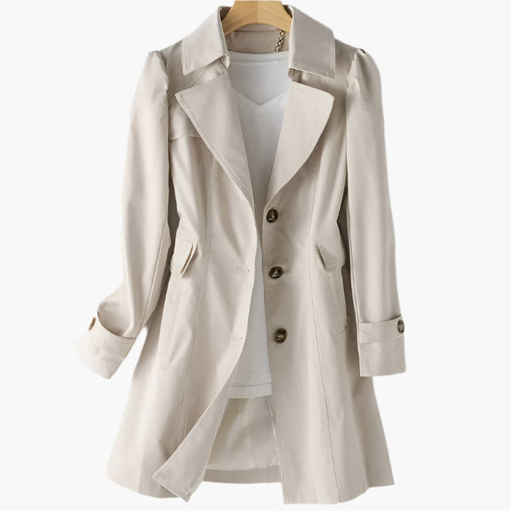 Elegant damtrenchcoat i beige för kvinnor, perfekt som mångsidig vårkappa eller höstkappa. Klassiskt ytterplagg.
