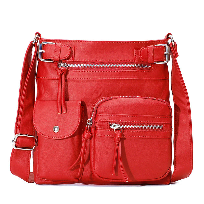 "Elegant damväska i veganskt läder, crossbody med flera fickor, vattentät och stilfull design för optimal organisation."