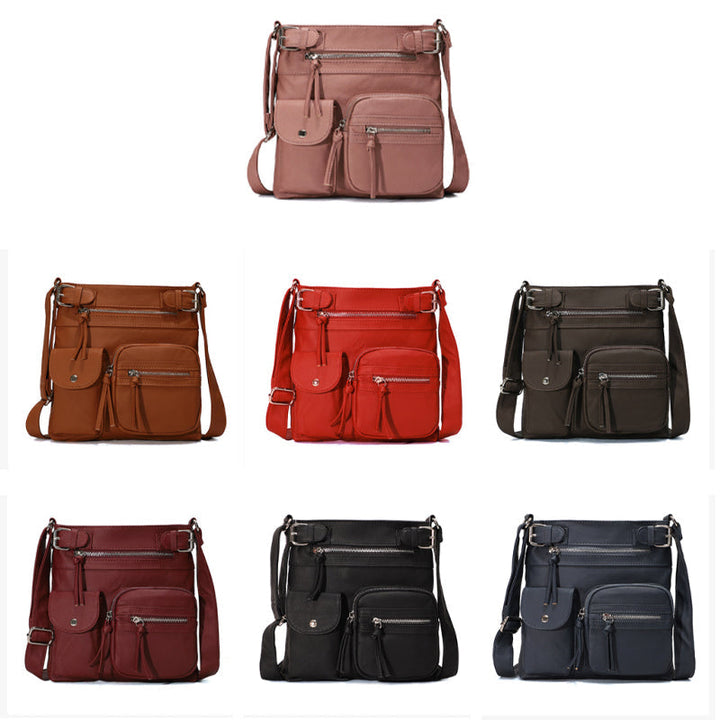 "Elegant damväska i veganskt läder, crossbody med flera fickor, vattentät och stilfull design för optimal organisation."