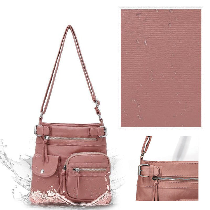 "Elegant damväska i veganskt läder, crossbody med flera fickor, vattentät och stilfull design för optimal organisation."