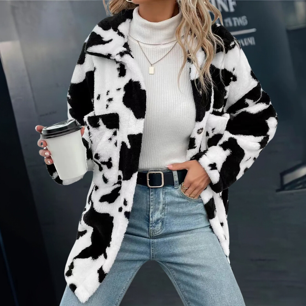 Elegant damvinterjacka i svart, perfekt för kalla dagar. Varmt ytterplagg med stilren design.