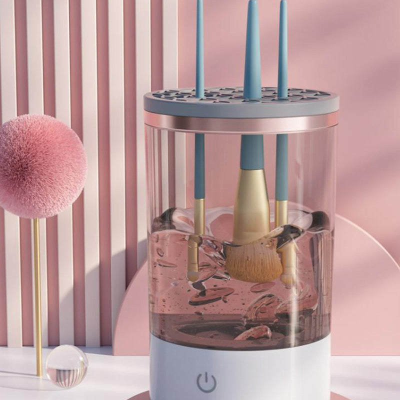 "Elegant elektrisk sminkborstrengörare för alla borsttyper, med svart och transparent design, förbättrar rengöring och hållba