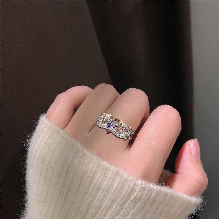 "Elegant februari ametyst ring i silver för kvinnor, handgjord, detaljrik design med hjärta och oändlighetsband."