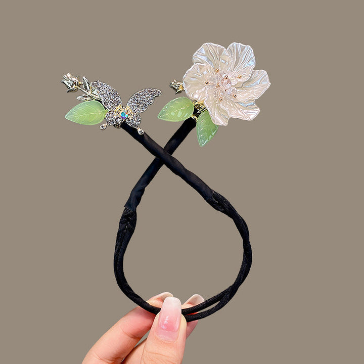 "Elegant, flexibel hårklämma med diamantdetaljer för kvinnor; stilren och halkfri design, perfekt för alla frisyrer."