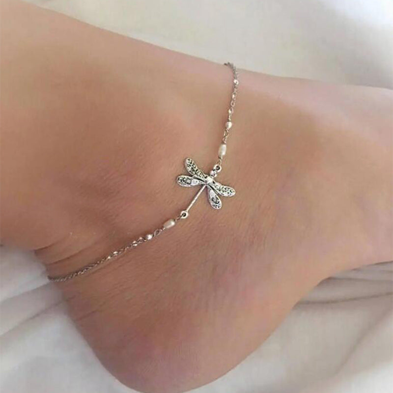 "Elegant fotkedja i sterling silver med glittrande trollslända, justerbar kedja, passar perfekt till alla damaccessoarer."