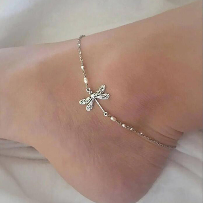 "Elegant fotkedja i sterling silver med glittrande trollslända, justerbar kedja, passar perfekt till alla damaccessoarer."