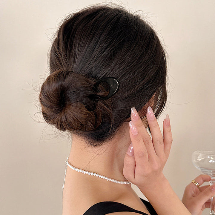 "Elegant fransk hårnål i mångfärgad design för stilfull hårstyling; perfekt damaccessoar för alla tillfällen."
