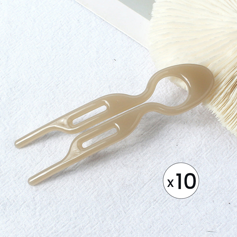 "Elegant fransk hårnål i mångfärgad design för stilfull hårstyling; perfekt damaccessoar för alla tillfällen."
