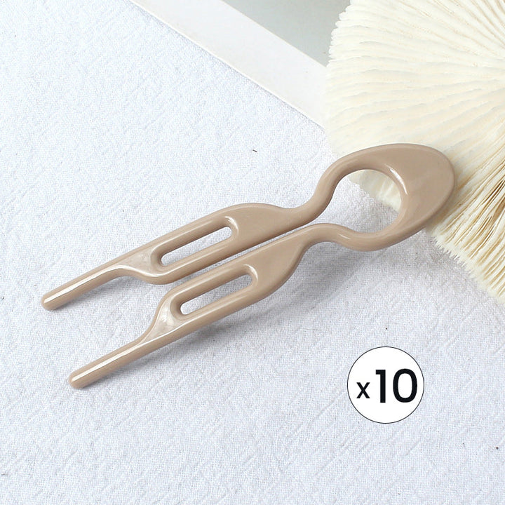 "Elegant fransk hårnål i mångfärgad design för stilfull hårstyling; perfekt damaccessoar för alla tillfällen."