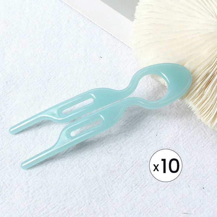 "Elegant fransk hårnål i mångfärgad design för stilfull hårstyling; perfekt damaccessoar för alla tillfällen."