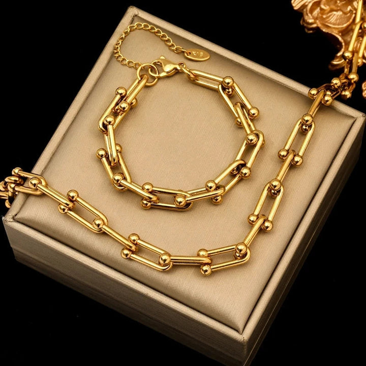 Elegant guld länkset för kvinnor, tidlöst halsband och armband. Perfekt damsmycken.