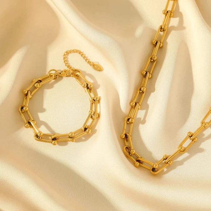Ultimat elegans: Guld länkset med tidlöst halsband och armband, ett måste bland damsmycken.