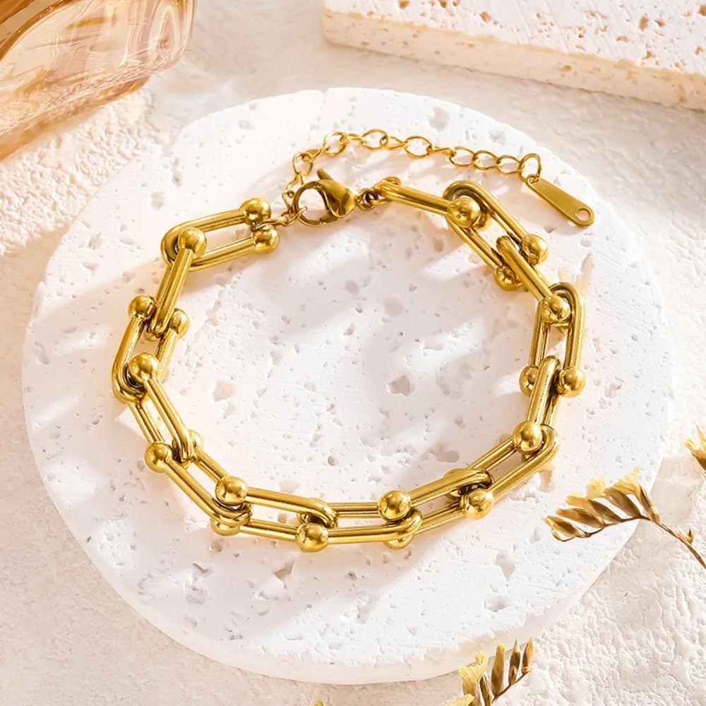 Klassiskt guld länkset, polerat halsband och armband i elegant design för dam.