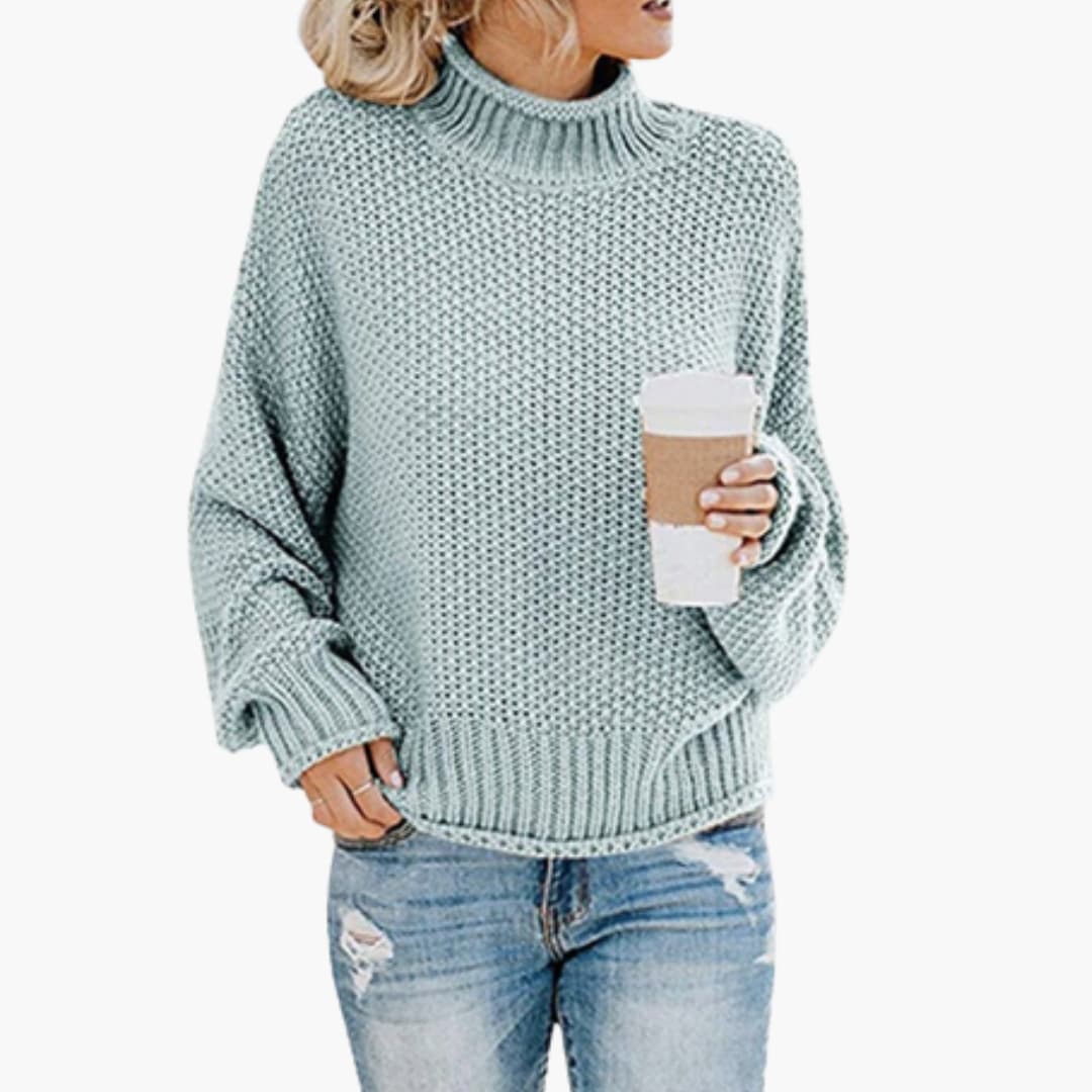 Elegant höghalsad damtröja med långa ärmar. Mysig stickad pullover för höst och vinter.