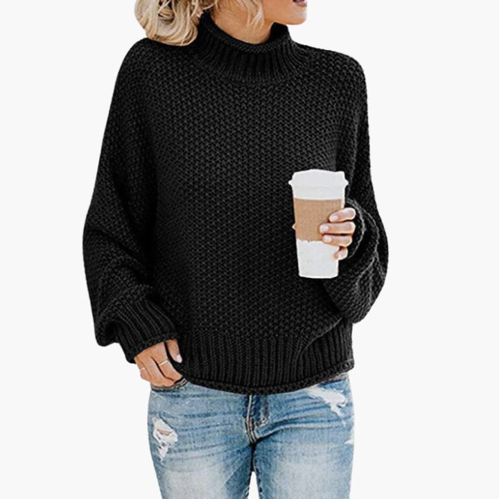 Stilren stickad damtröja för höstmode. Höghalsad pullover, varm och bekväm för kvinnor.