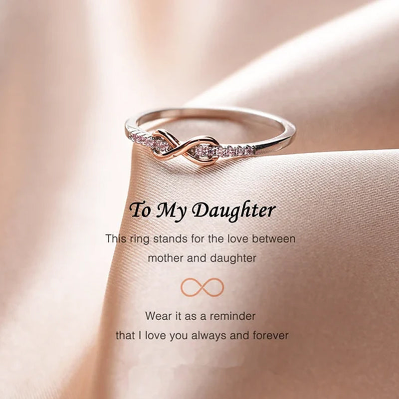"Elegant infinityring för damer, symboliserar evig kärlek med oändlig knut, tillgänglig i rosa guld, silver, guld."