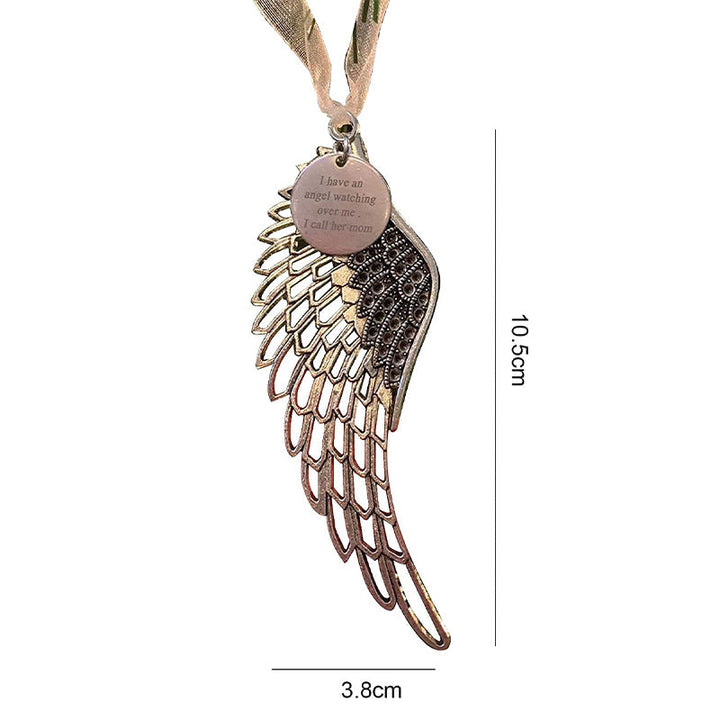 "Elegant juldekoration i brons med änglavingar, perfekt för att hylla familjens kärlek och prydnad i hemmet."