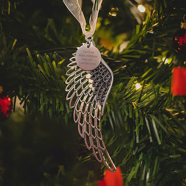 "Elegant juldekoration i brons med änglavingar, perfekt för att hylla familjens kärlek och prydnad i hemmet."