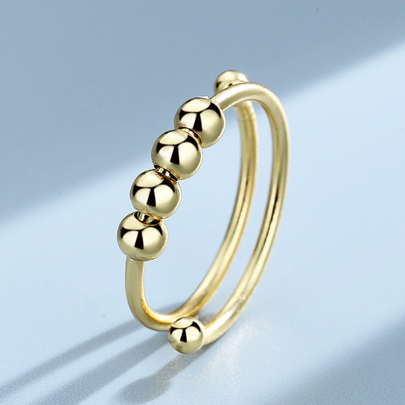 "Elegant justerbar ångestring med 4 roterbara metallpärlor för mindfulness och stresslindring, perfekt för kvinnors accessoar