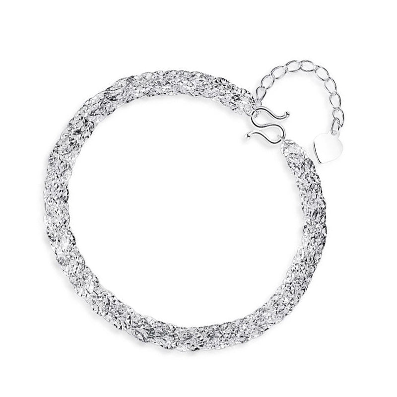 "Elegant justerbart Phoenix armband i guld/silver med unikt fjädermotiv, perfekt kvinnligt smycke för alla tillfällen."