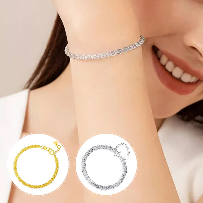 "Elegant justerbart Phoenix armband i guld/silver med unikt fjädermotiv, perfekt kvinnligt smycke för alla tillfällen."