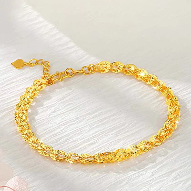 "Elegant justerbart Phoenix armband i guld/silver med unikt fjädermotiv, perfekt kvinnligt smycke för alla tillfällen."