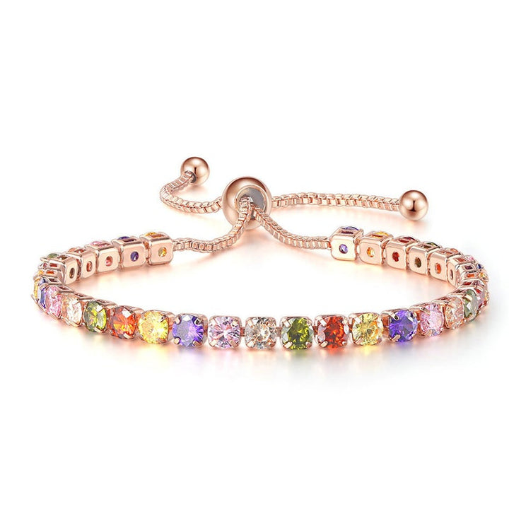 "Elegant justerbart zirkonarmband i rosguld/silver med glidspänne, flerfärgade zirkoner och boxkedja."