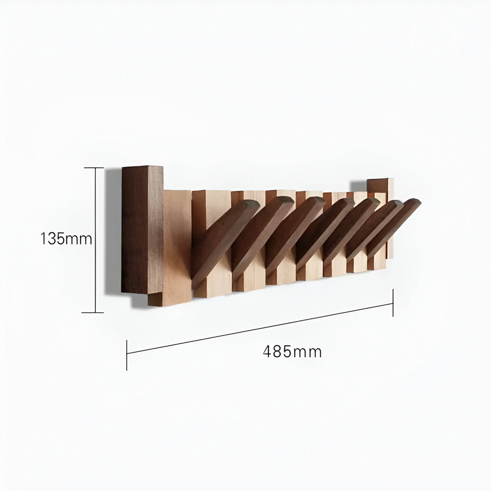 Stilren väggkrok i pianodesign, perfekt som hallmöbel. Lägger till både elegans och praktisk förvaring.