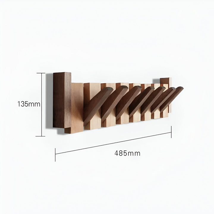 Stilren väggkrok i pianodesign, perfekt som hallmöbel. Lägger till både elegans och praktisk förvaring.